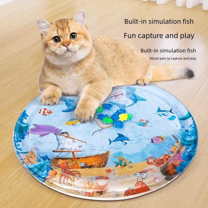 The Tailored Tail inflatable PVC cooling water mat for cats featuring a colorful shark pirate ship underwater design